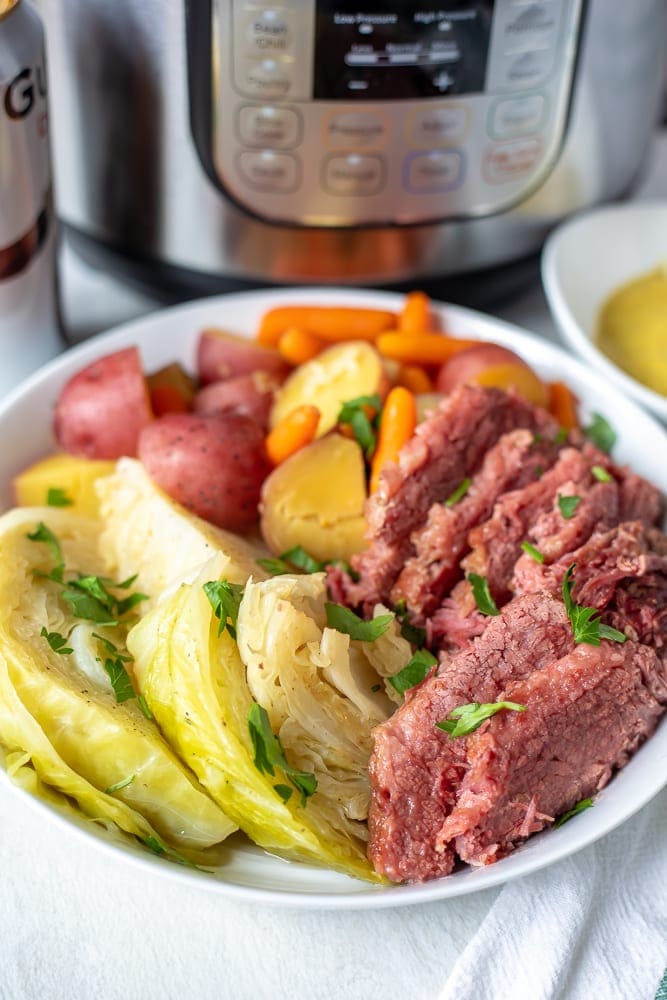 Corned Beef, Cabbage, Potatoes, and Carrots next to Instant Pot.