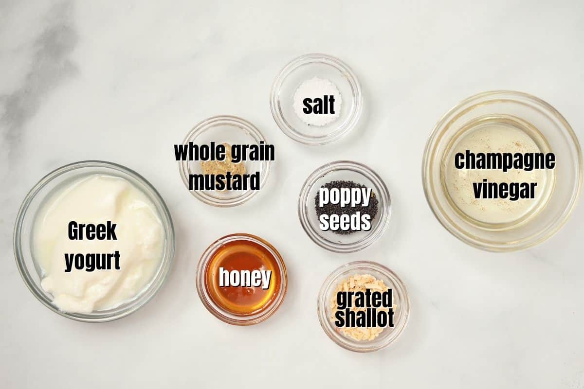 Ingredients for Creamy Poppy Seed Dressing labeled on counter. 