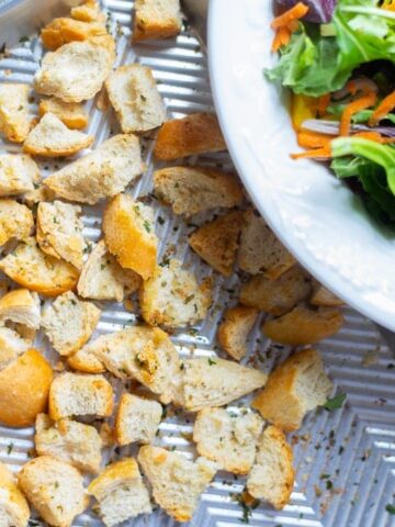 Baking Sheet with Seasoned Croutons on it
