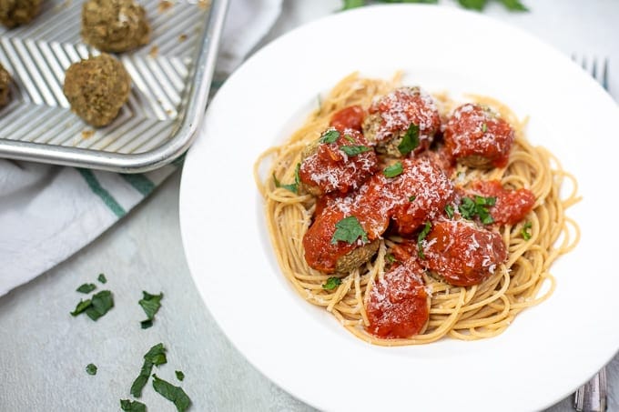 Bowl of spaghetti and lentil meatballs with marinara sauce.