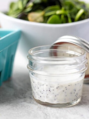 Creamy Poppy Seed Salad Dressing in small glass jar