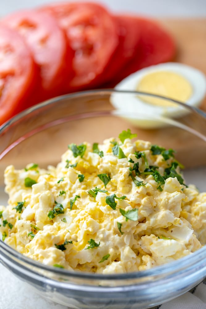 Bowl of Egg Salad topped with parsely.