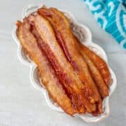 Crispy Oven Baked Bacon on White Plate