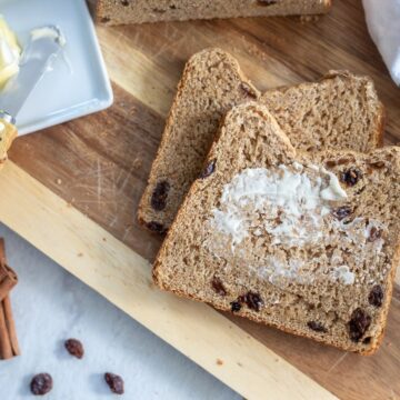 Cinnamon Bread with butter being spread
