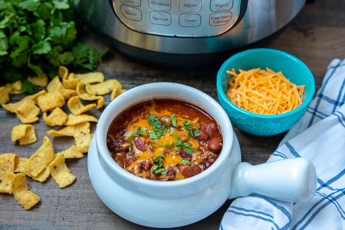 Bowl of Instant Pot Chili Next to Instant Pot