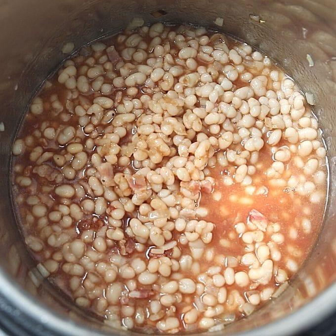 Beans with seasonings in Instant Pot.