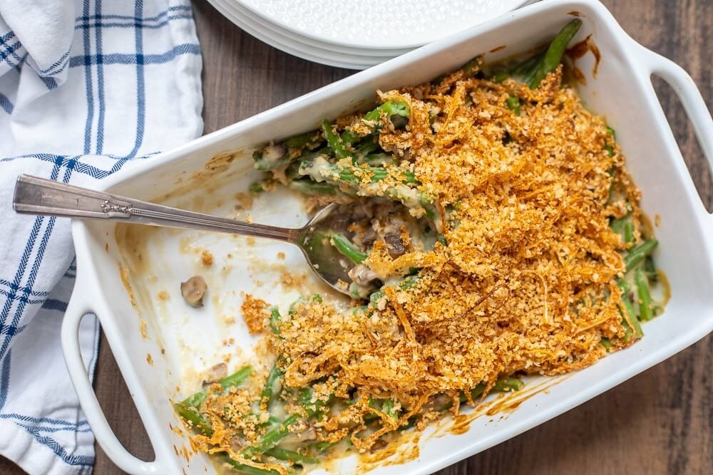 Baked Green Bean Casserole in Dish with serving spoon.