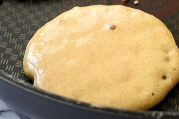 Whole Wheat pancake in griddle with small bubbles
