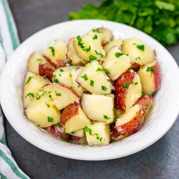 Bowl of red buttered potatoes with parsley