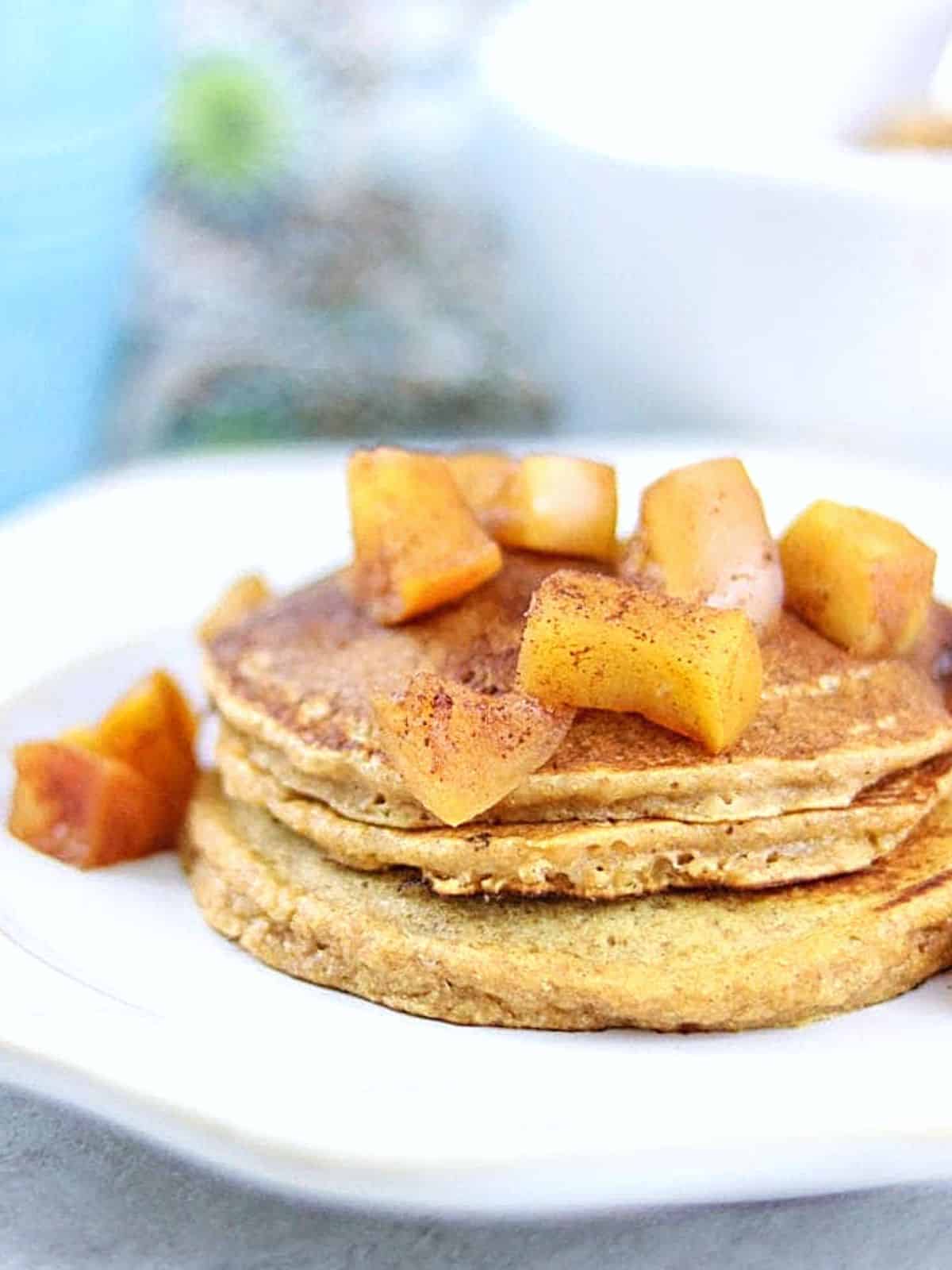 Stack of sweet potato pancakes with apple compote. 