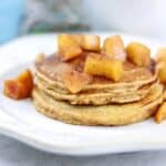 Stack of sweet potato pancakes with apple compote.