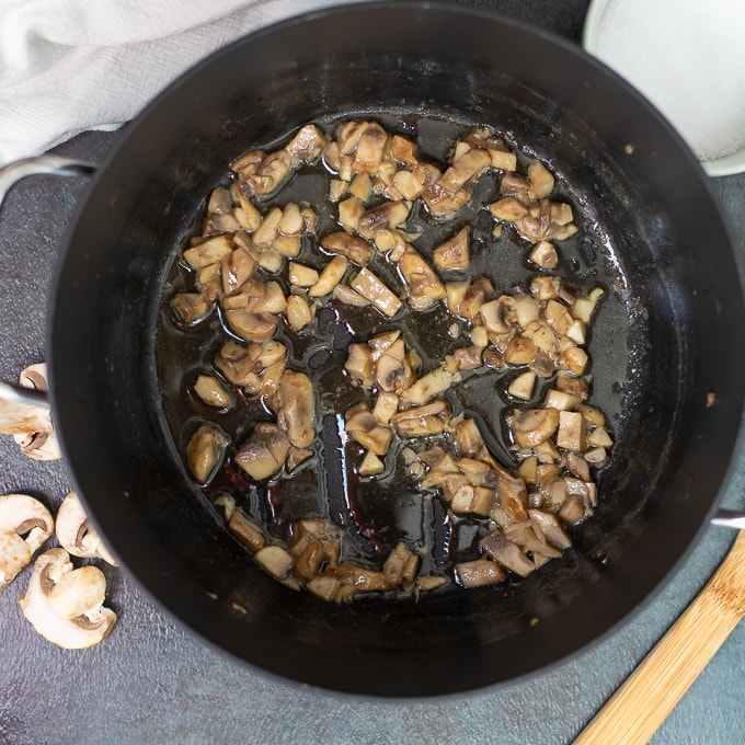 Mushrooms sauteed in butter in heavy skillet.