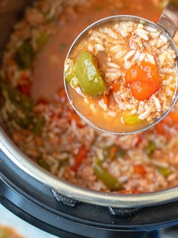 Ladle of Stuffed Peppers Soup coming out of Instant Pot