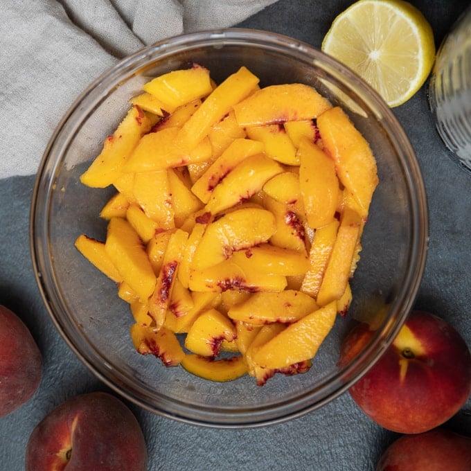 Sliced peaches in mixing bowl
