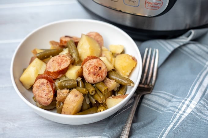 Instant Pot Potatoes with Smoked Sausage and Green Beans in white bowl