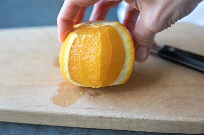 A navel orange with the peel removed