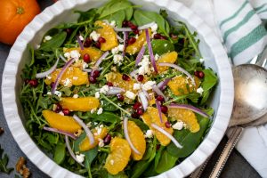 Mixed greens topped with oranges, pomegranates, and feta.