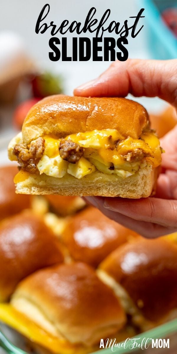 Make breakfast more fun with these sweet and savory Breakfast Sliders! Eggs, sausage, and cheese are piled high in slider bunds and then topped with buttery maple syrup for one out of this world breakfast sandwich. 