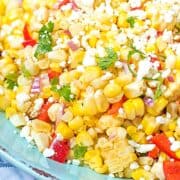 Close up of corn salsa topped with feta and cilatnro