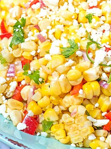 Close up of corn salsa topped with feta and cilatnro