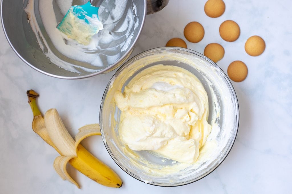 Vanilla Pudding being folded into whipped cream in mixing bowl