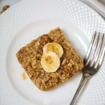 Baked Oatmeal on a white plate next to a fork