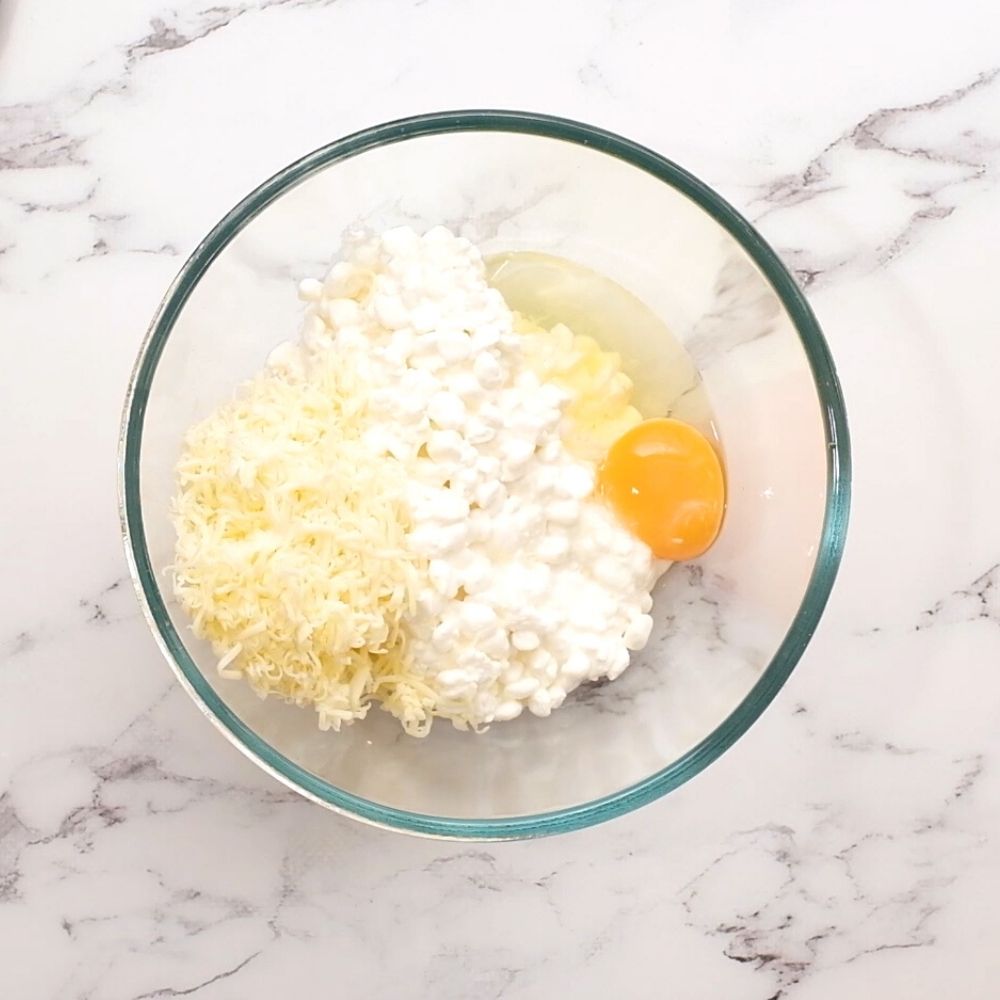 Cottage Cheese with cheese and egg in glass bowl