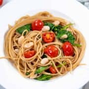Pasta with white beans, spinach and tomatoes