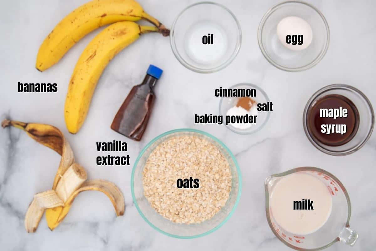 Ingredients for baked banana oatmeal labeled on counter. 
