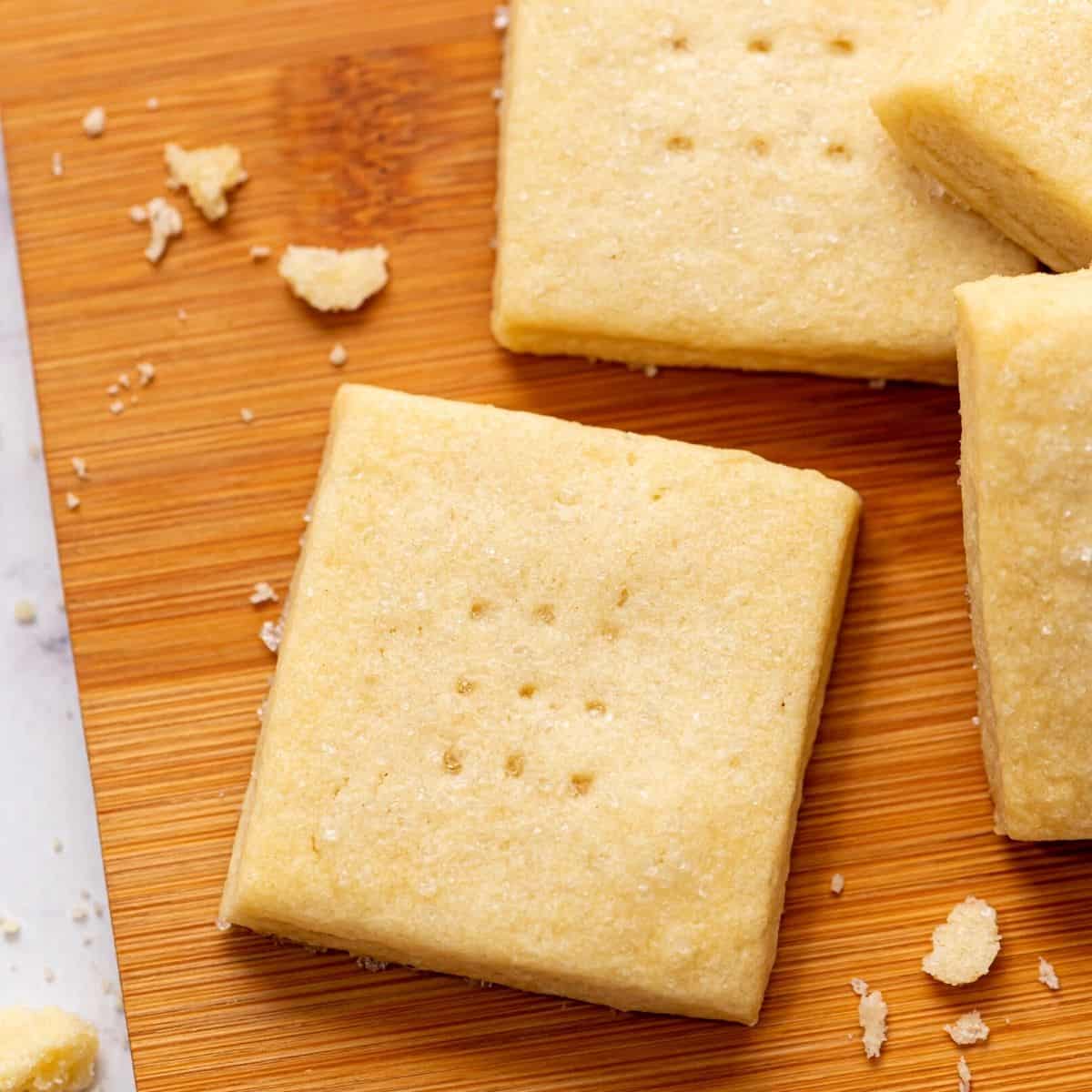 Baked Shortbread Cookies on wooden Cutting board.