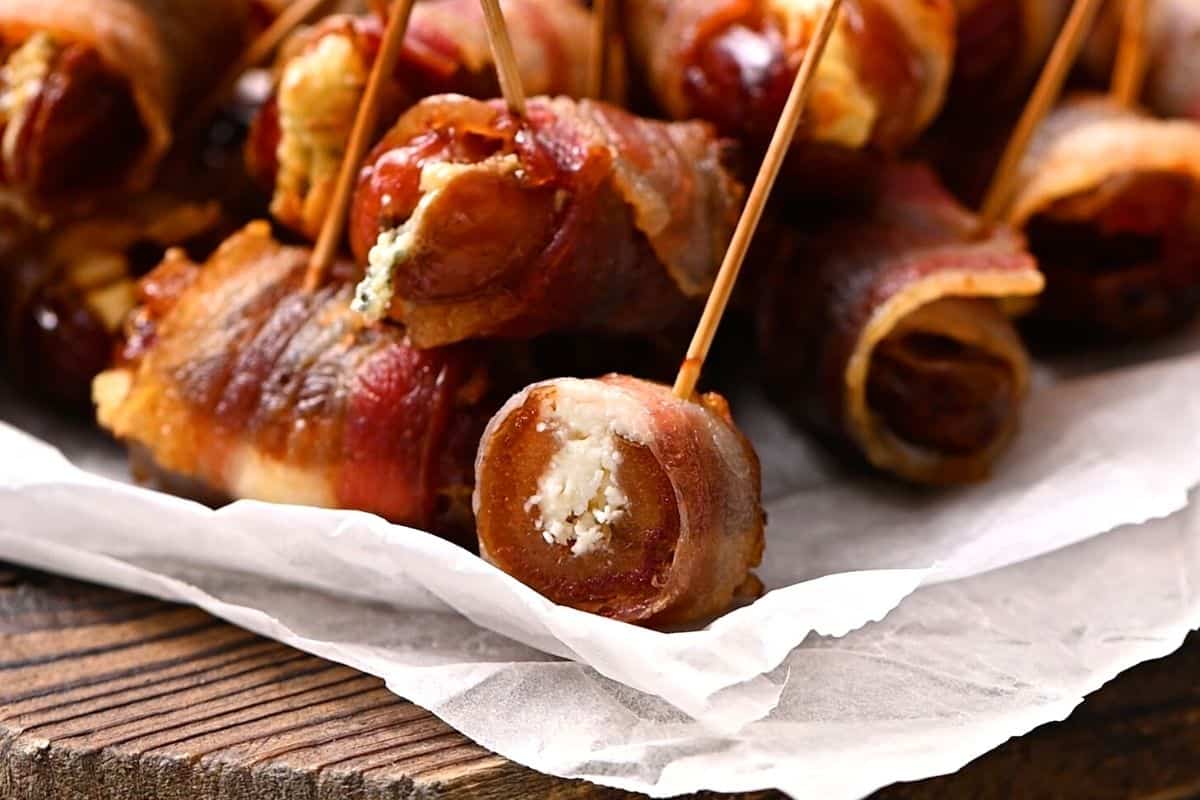 Bacon Wrapped Date cut open to show goat cheese filling.