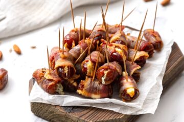Stuffed Bacon Wrapped Dates on platter.