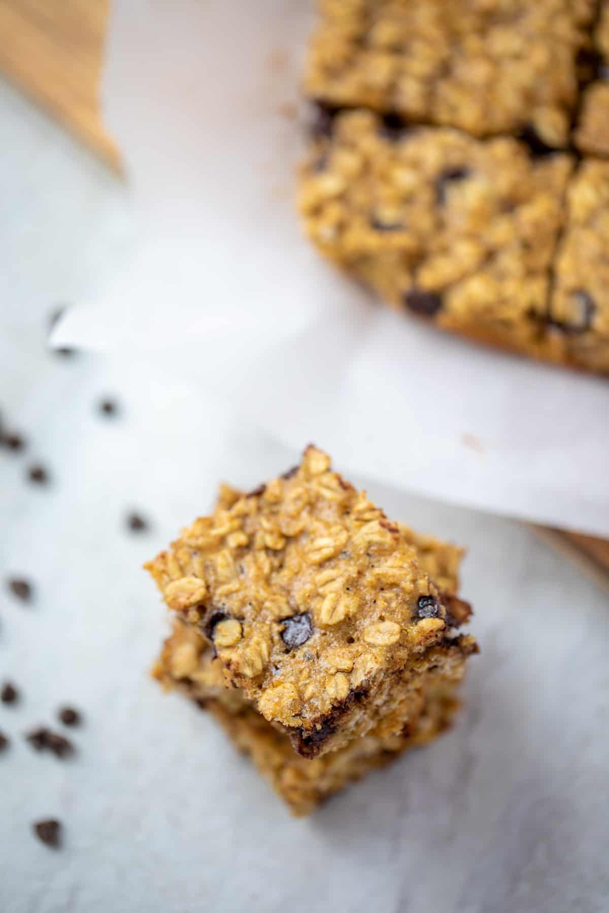 Chocolate Chip Oatmeal Bars cut into bars and stacked on top of eachother.