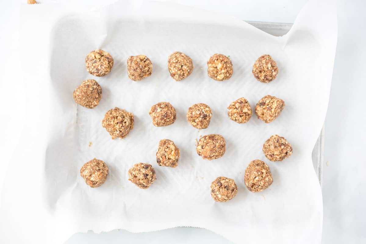 Energy Balls rolled out onto a sheet pan. 
