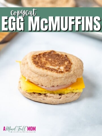 Egg McMuffin on white counter with green title text overlay.