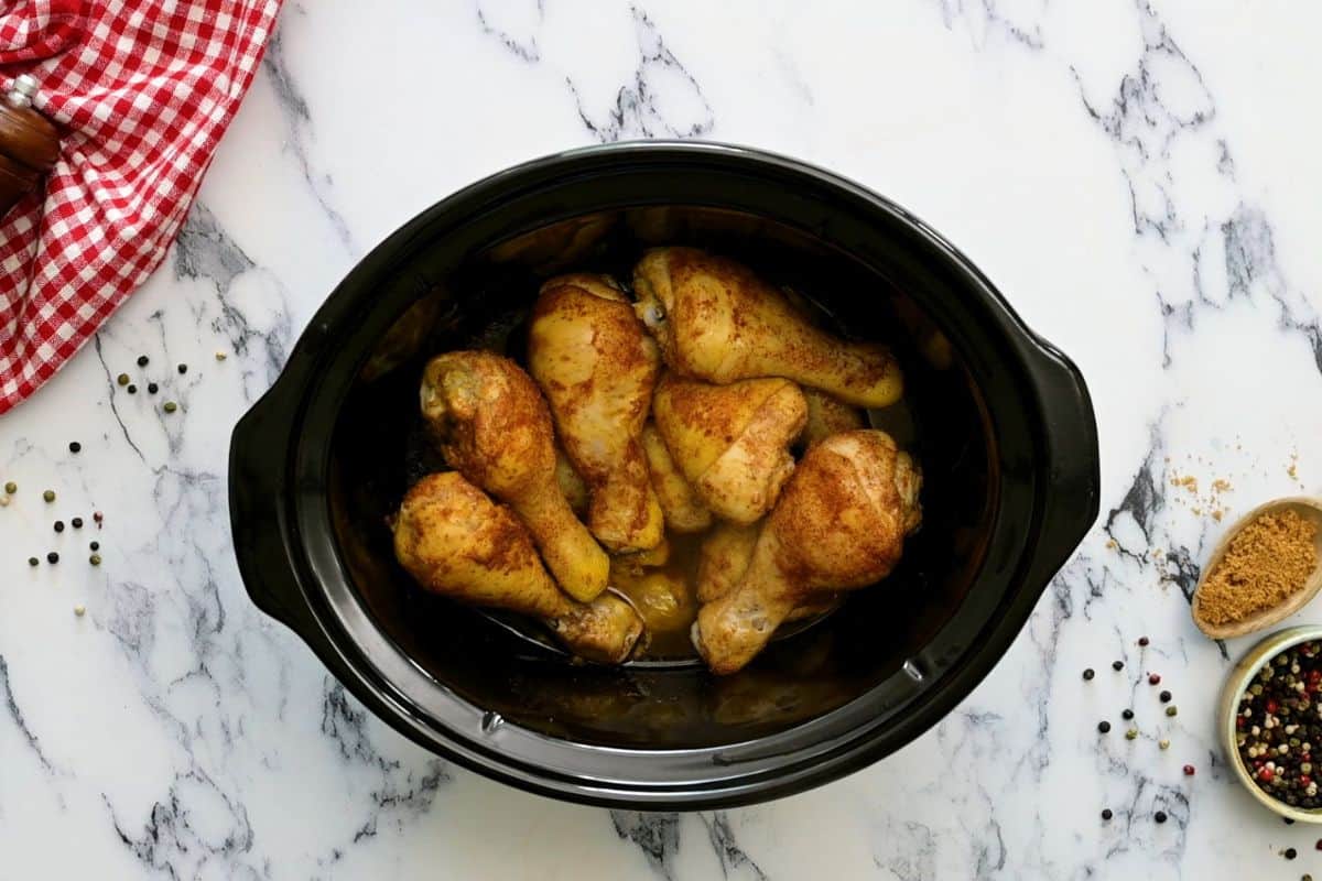 Cooked chicken legs in slow cooker.