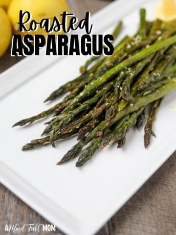 Roasted Asparagus on white platter with black title text reading roasted asparagus.