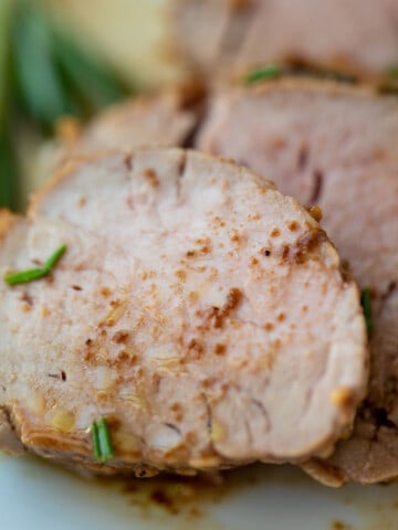 Close up of sliced baked pork tenderloin.