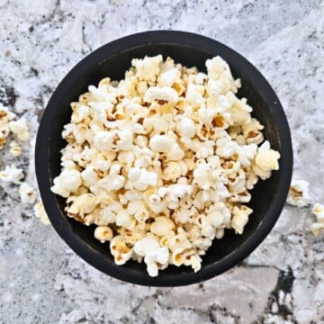 Homemade Microwave Popcorn in black bowl.