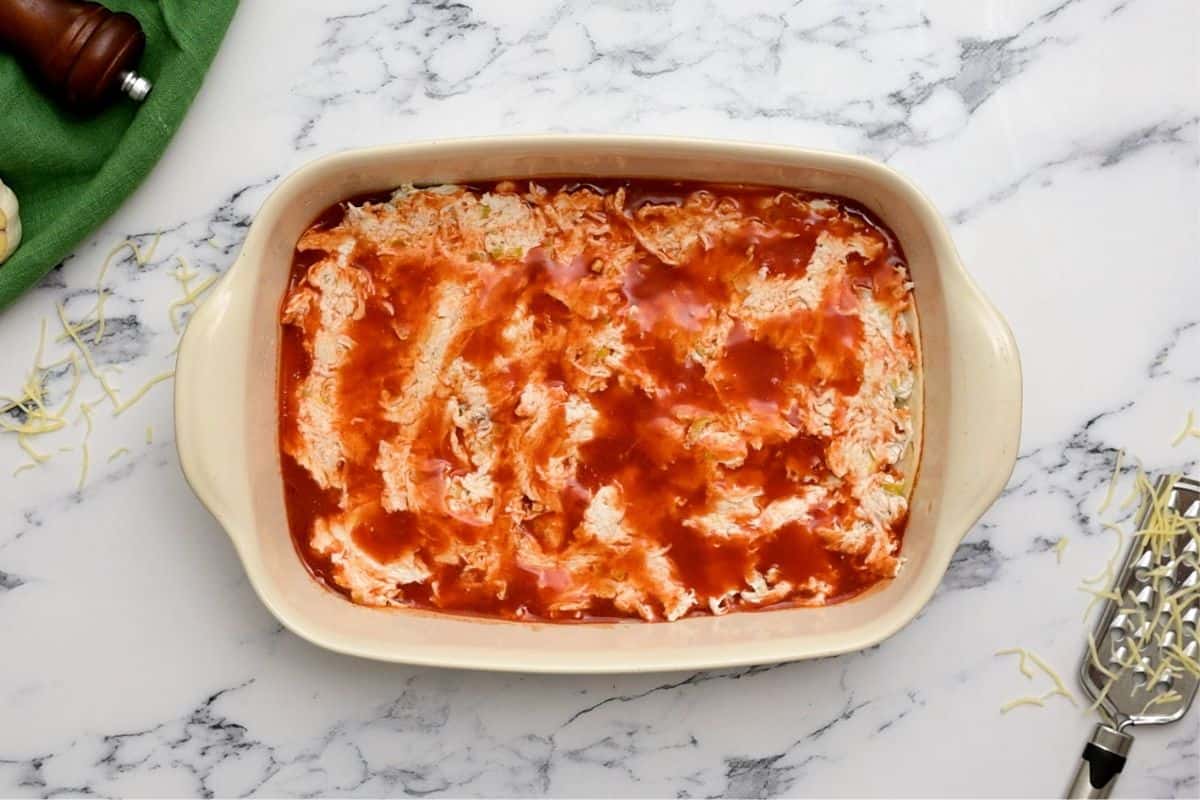 Cream cheese mixture topped with a bit of enchilada sauce.