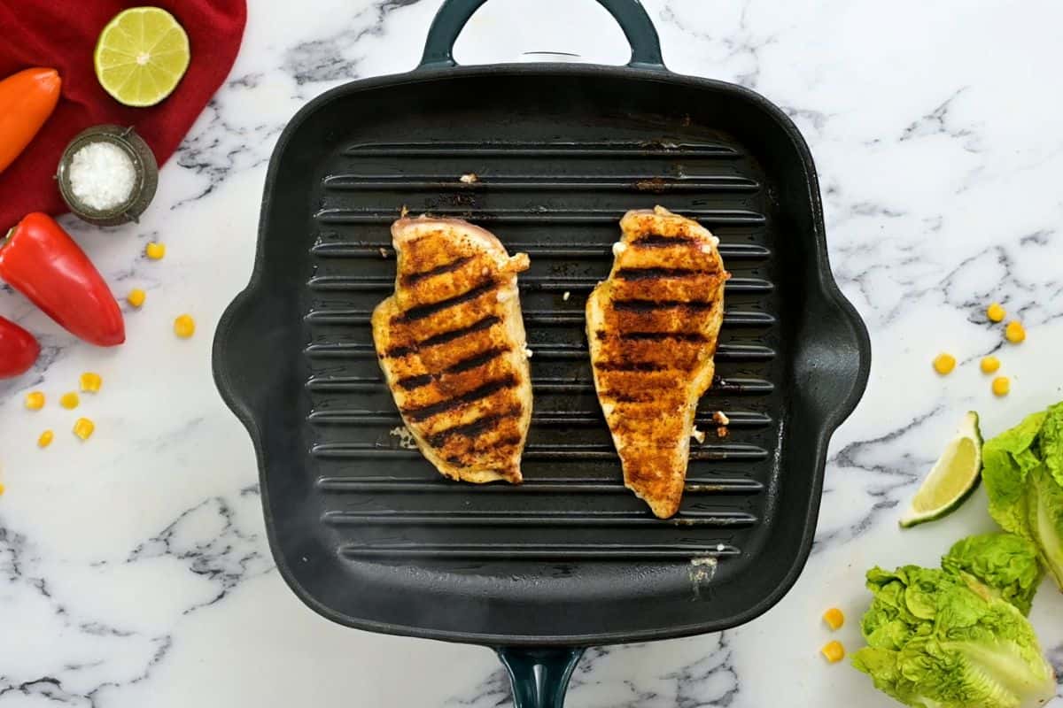 Seasoned Chicken on grill pan after being grilled.