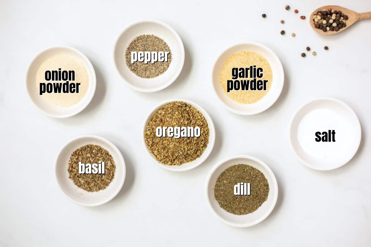Spices for Greek Seasoning labeled on counter.
