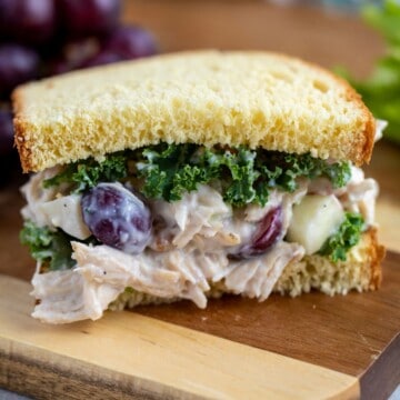 Waldorf Chicken Salad on bread with leafy green lettuce.