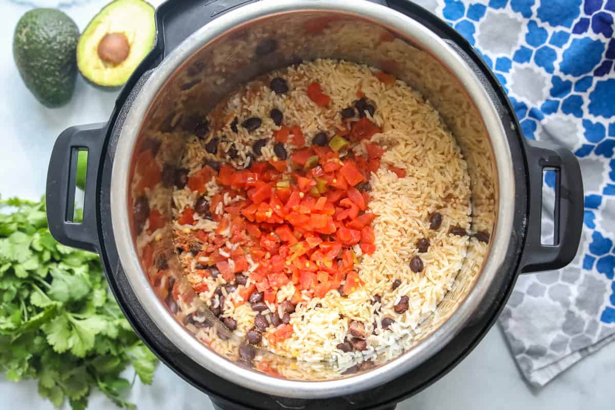 Cooked rice and beans inside inner pot of Instant Pot. 