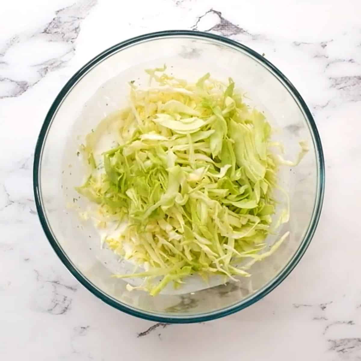 Cabbage mixed together with yogurt, cilantro, and lime juice. 