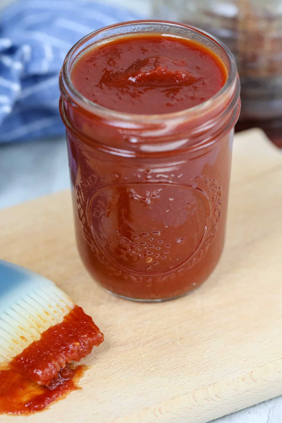 Jar of homemade BBQ sauce in glass jar.