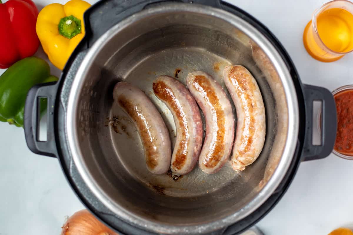 Seared Italian Sausage in inner pot of Instant Pot. 