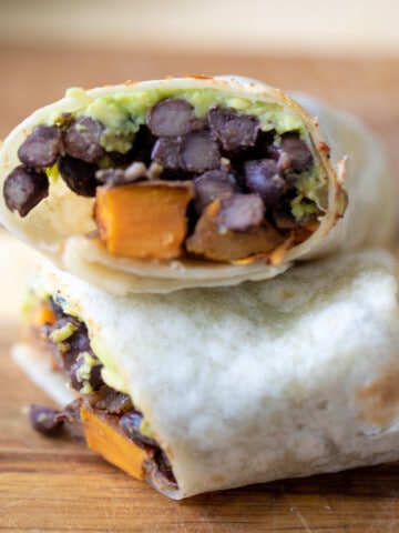 Burrito filled with black beans, sweet potaoes and avocado.