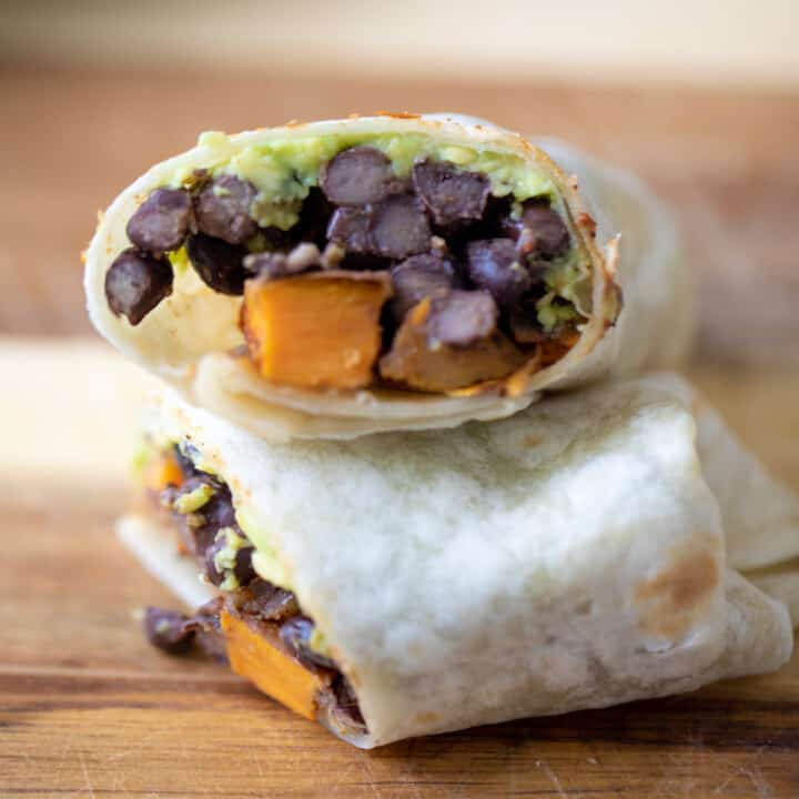 Burrito filled with black beans, sweet potaoes and avocado.