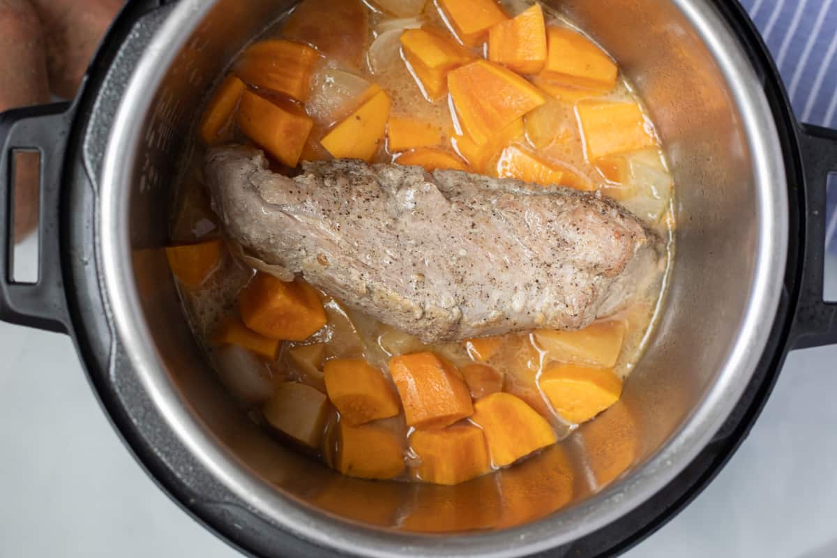 Cooked pork tenderloin in instant pot with cooked sweet potatoes. 